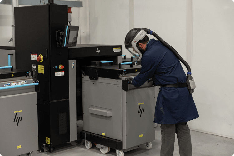 Metal Jet 3D Printing Man doing metal 3d printing