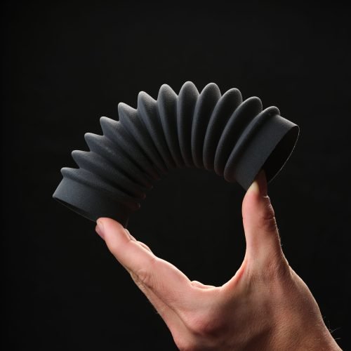 BAS TPU material tubing Hand holding a tpu material 3d printed tube for industrial and automotive applications